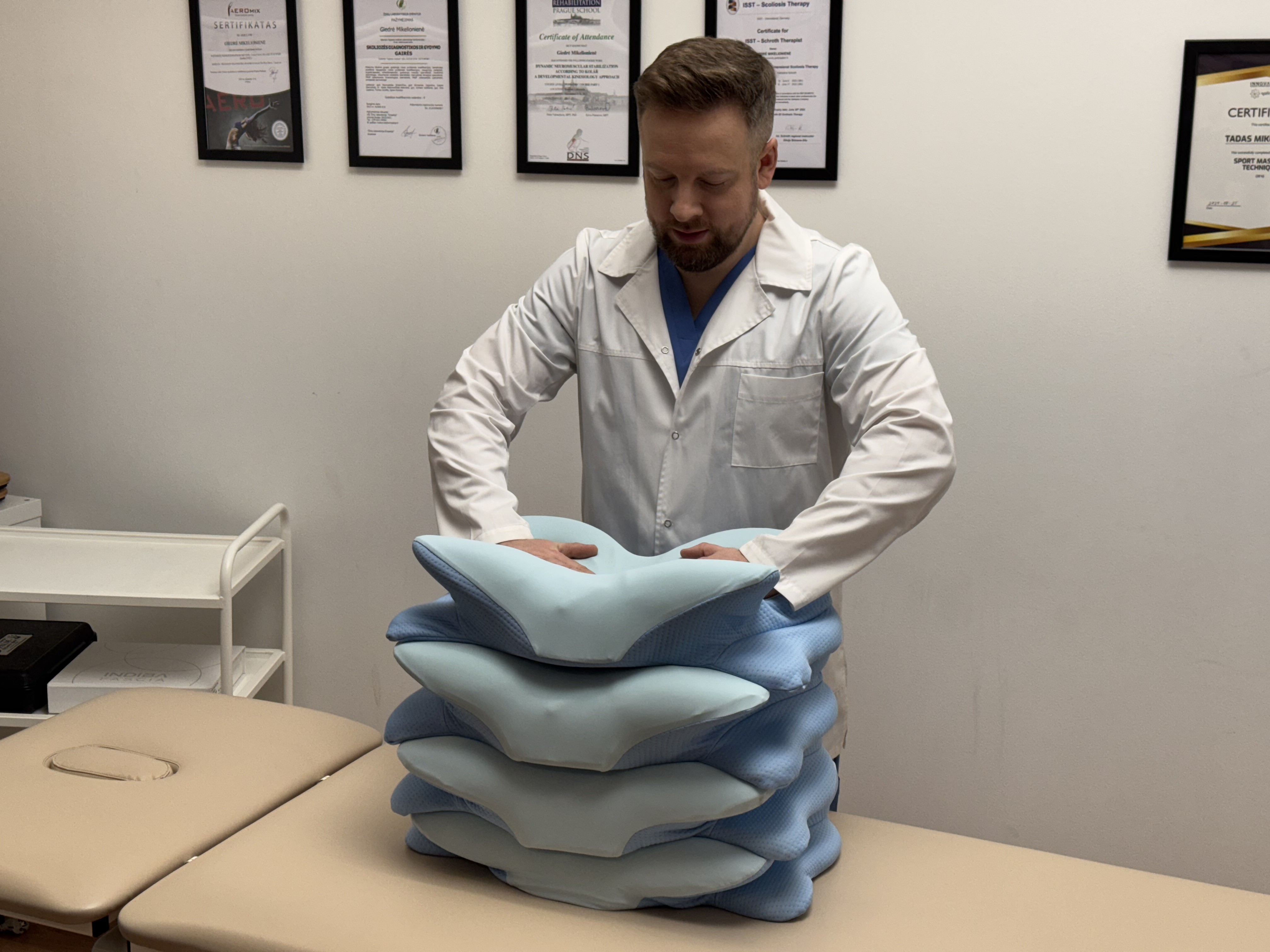 Healthcare professional examining Derila ERGO orthopedic pillows